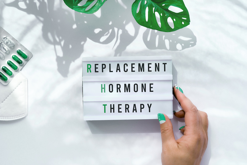 Replacement Hormone Therapy on light box in hand.