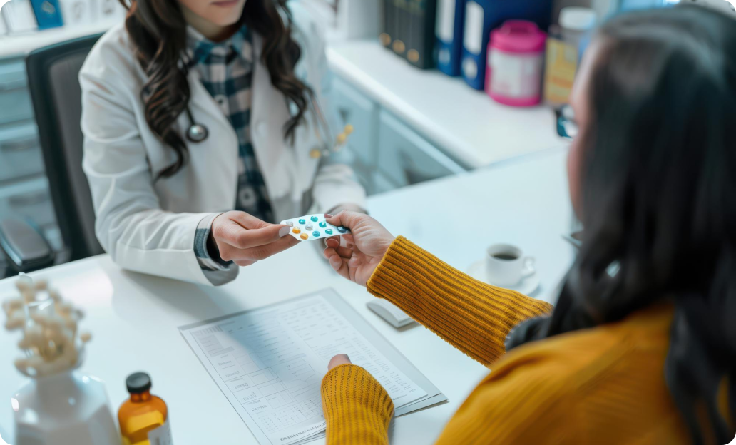 Doctor handing medication to patient